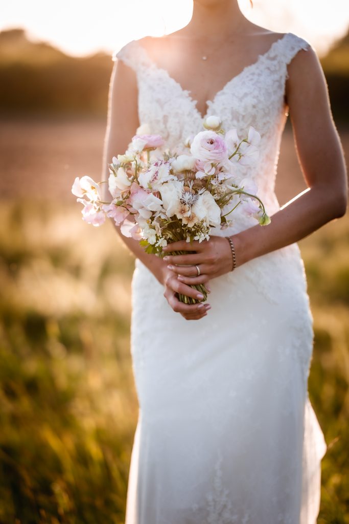 Sunset wedding photos bride and bouquet