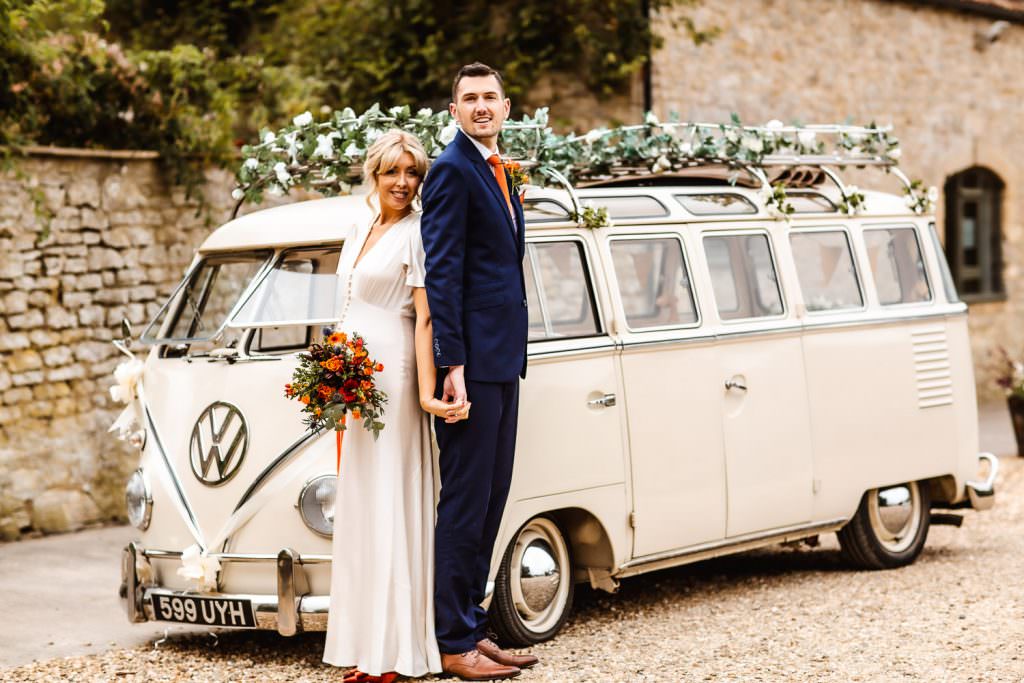 Autumn wedding at Priston Mill, Bath, Somerset. Wedding couple with W campervan