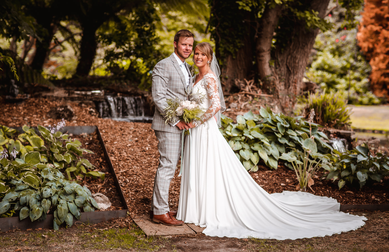 wedding photo of bride and groom in the garden at River Vale Barn Wedding Hampshire