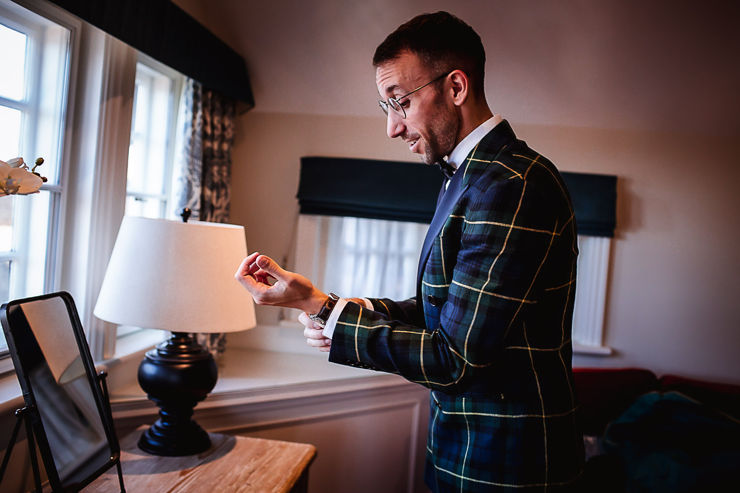 Winter Christmas wedding at Montague Arms Hotel, Beaulieu, New Forest, Hampshire. Groom is getting ready