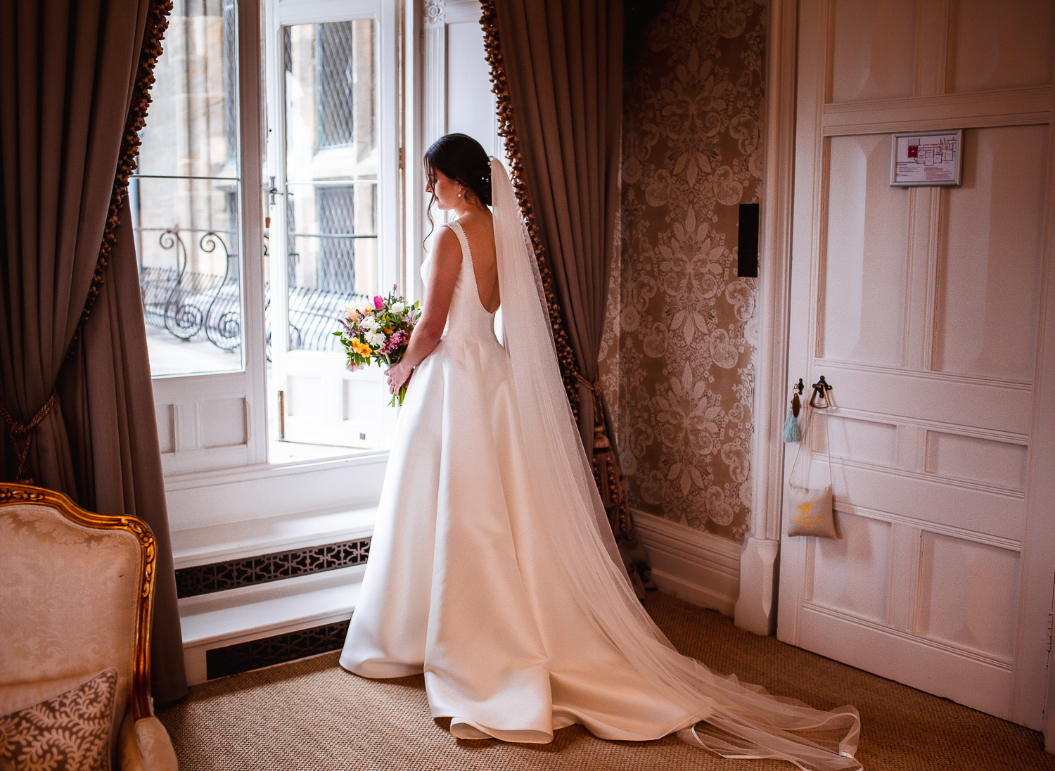 Bride portrait by the window at Cowdray House Midhurst