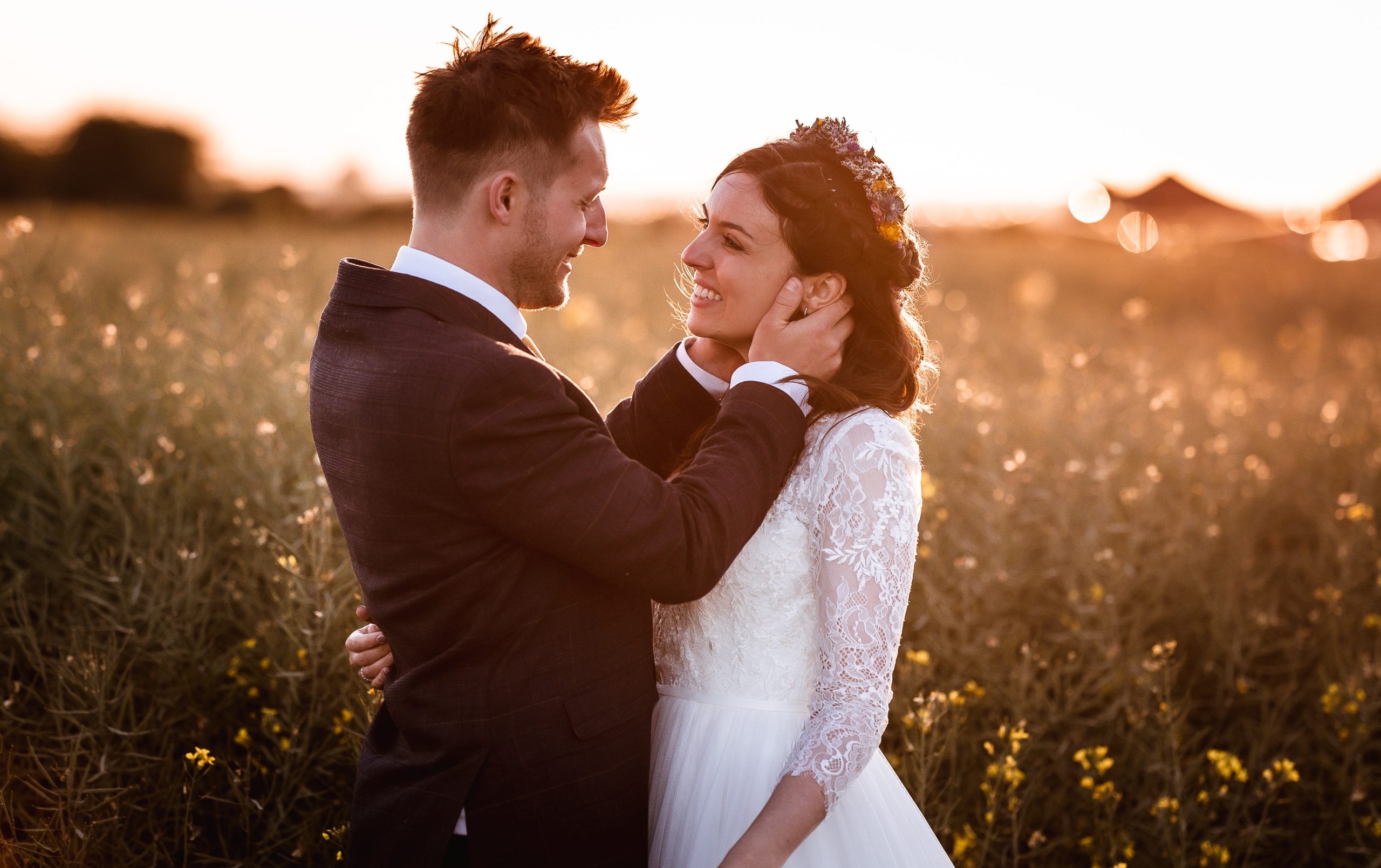 sunset photos of wedding couple in the field in West Sussex. Golden Hour wedding photo