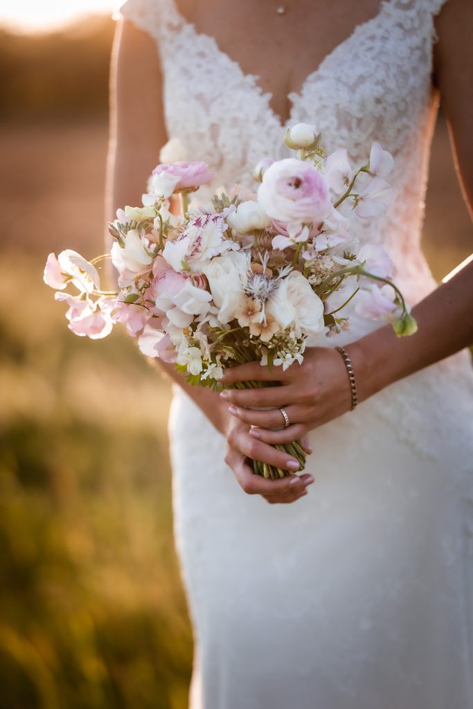 bride holds her wedding flowers bouquet