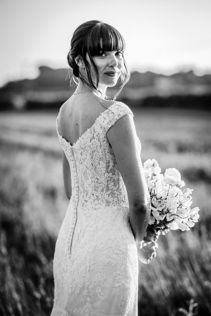 black and white photo of bride holding her flowers