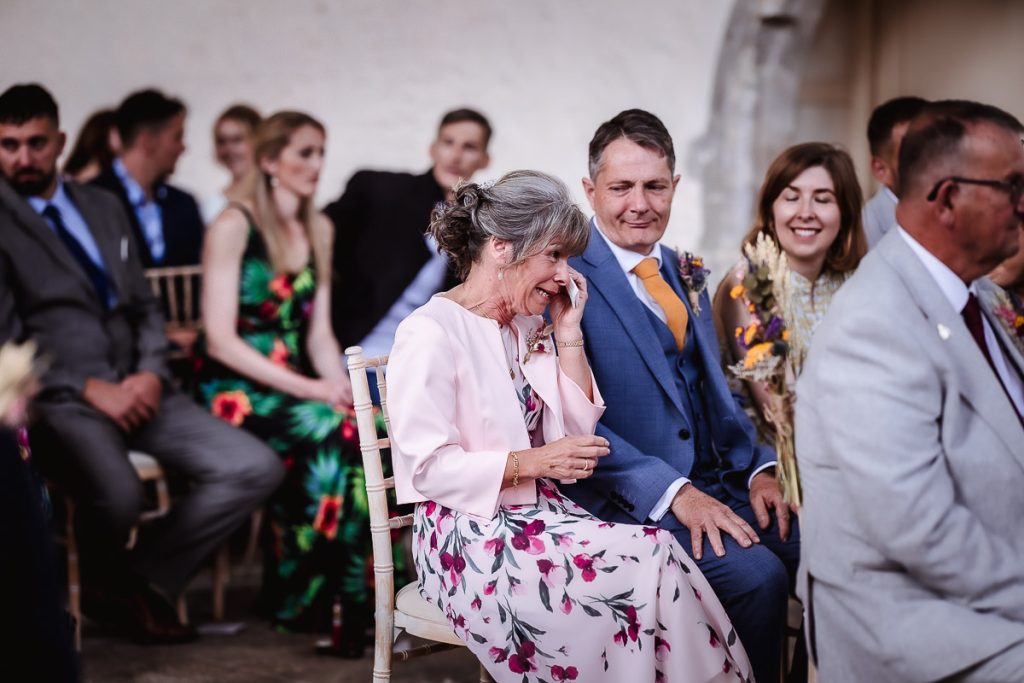 emotional photos of wedding guests watching bride and groom getting married at Guildhall, Chichester wedding photography