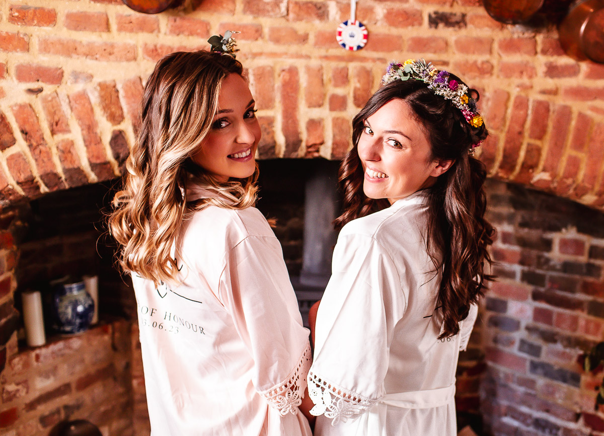 bride with her bridesmaid getting ready photos. Sussex Wedding photography