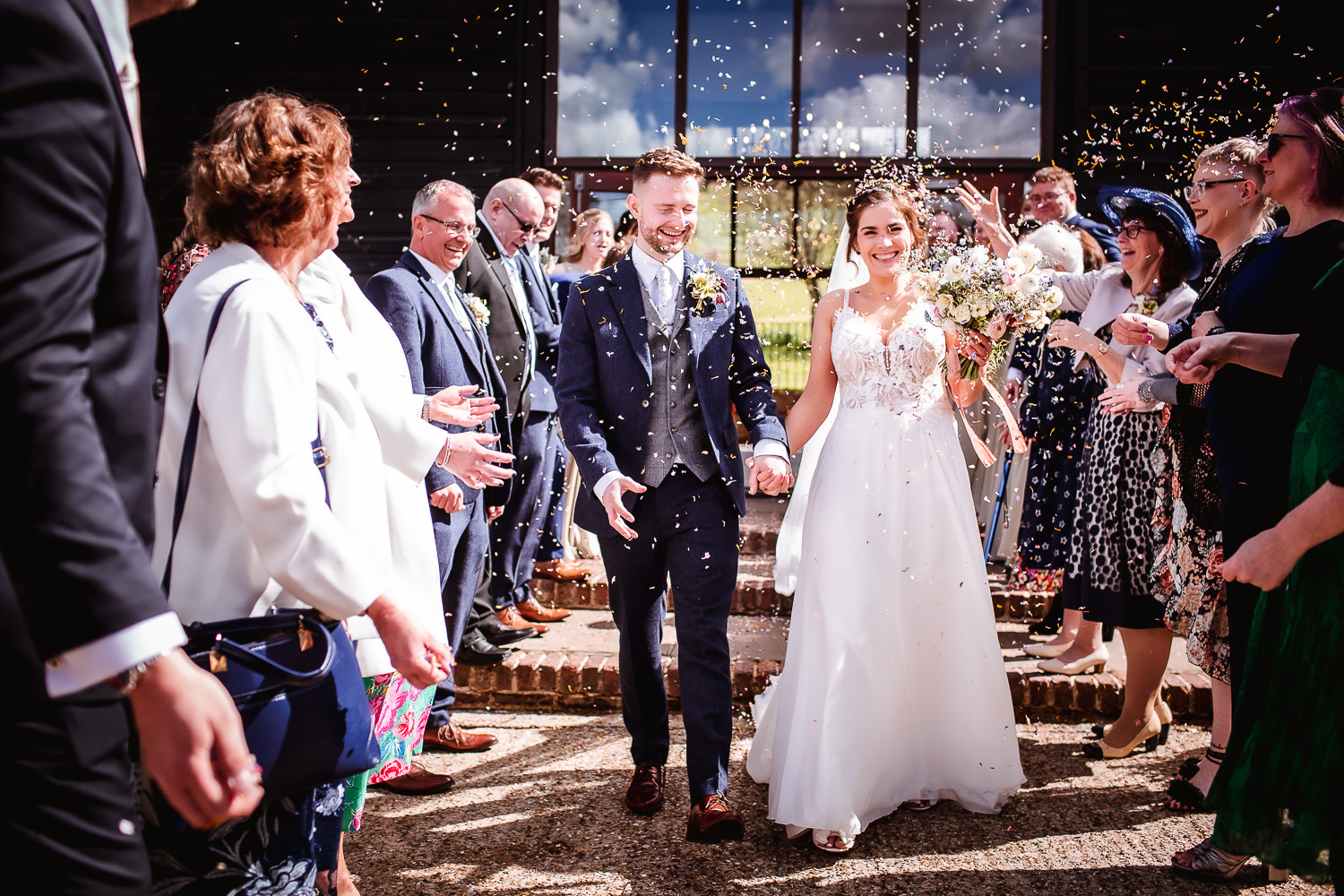 Confetti wedding photo of bride and groom at Upwaltham Barns, Petworth