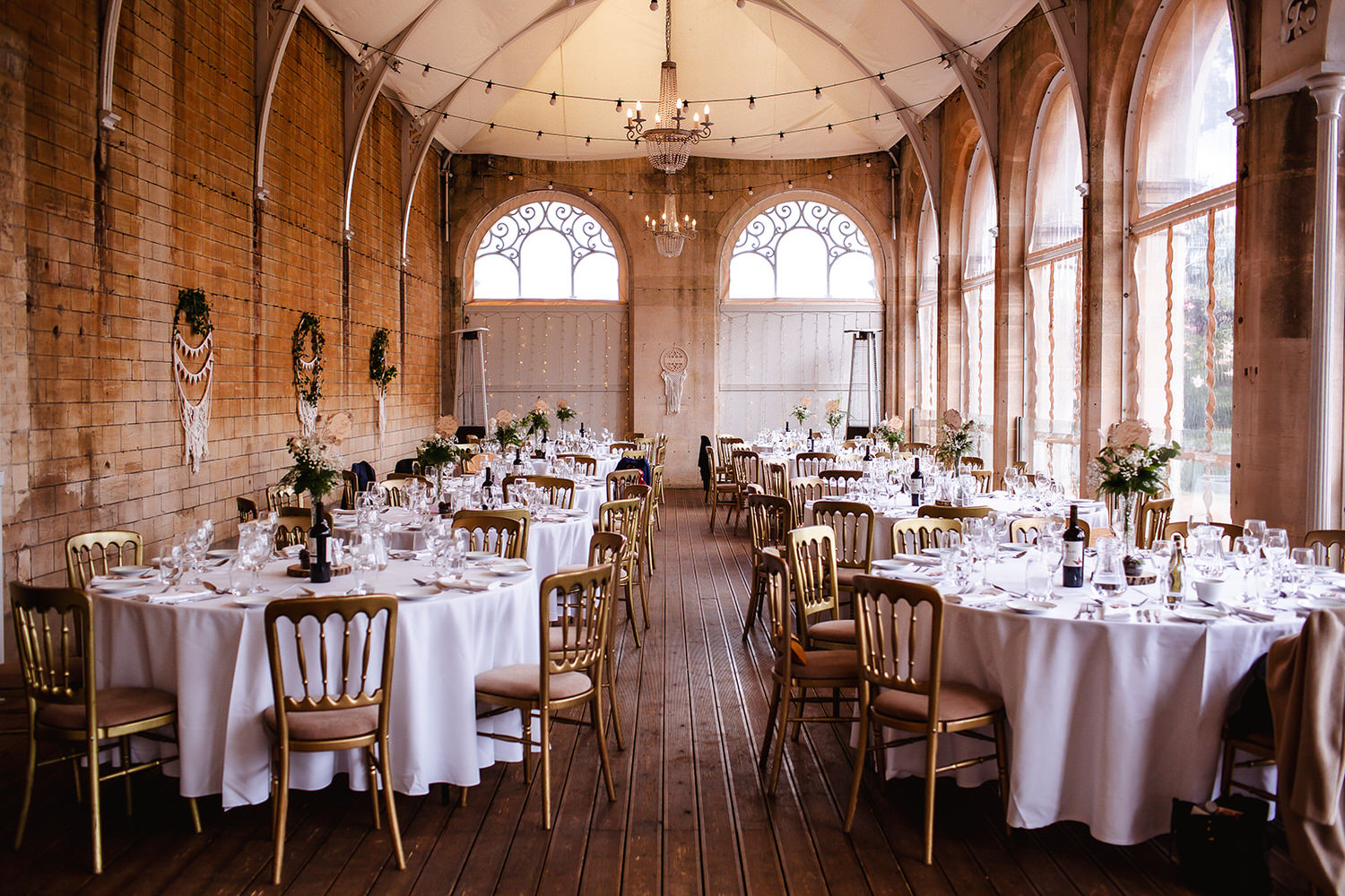 reception room with decorated tables and chair at Grittleton House.