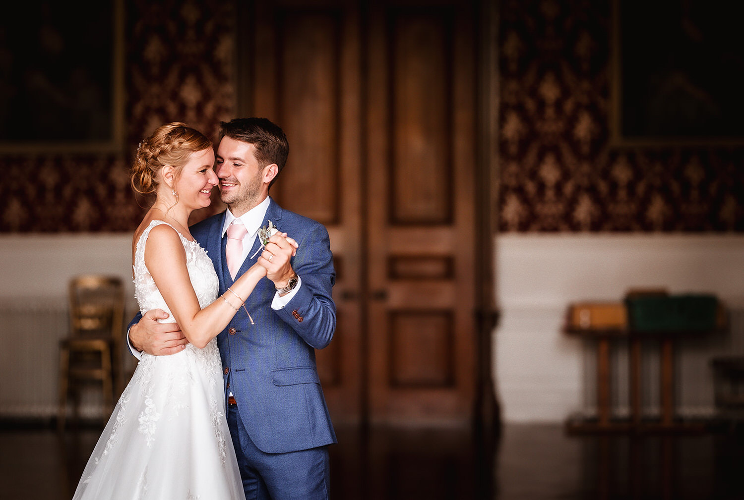 elegant and happy dance of bride and groom at luxury wedding venue at Grittleton House, Wiltshire