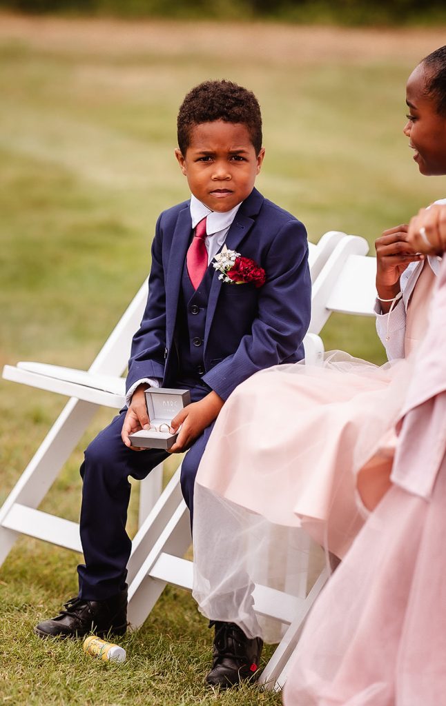 boy holding a box with wedding rings. Tournerbury Woods wedding photography