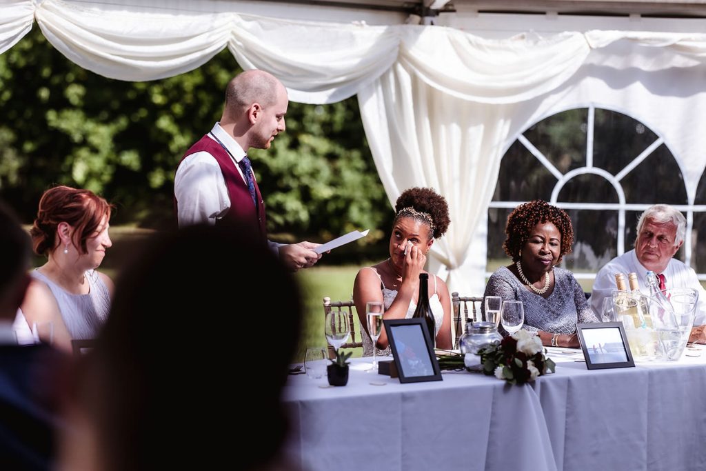 emotional bride during the speech at outdoor wedding venue at Hayling Island