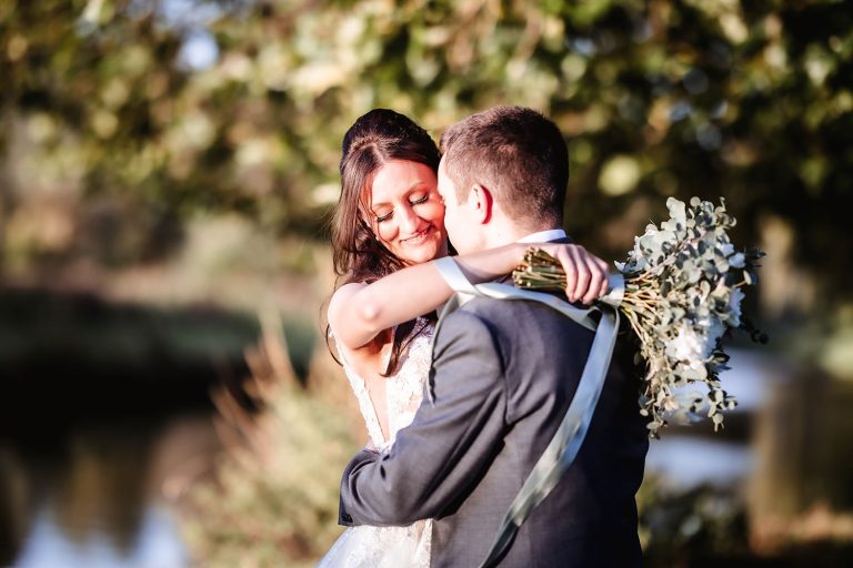 groom kissing his bride during the sunset in Winchester. Winchester autum wedding photography