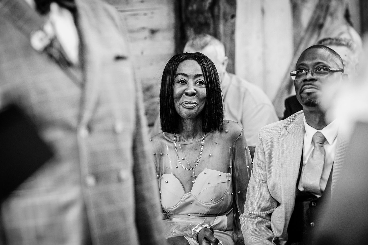 happy mother of bride watching her daughter's ceremony at rustic wedding ceremony at High Billinghurst Farm