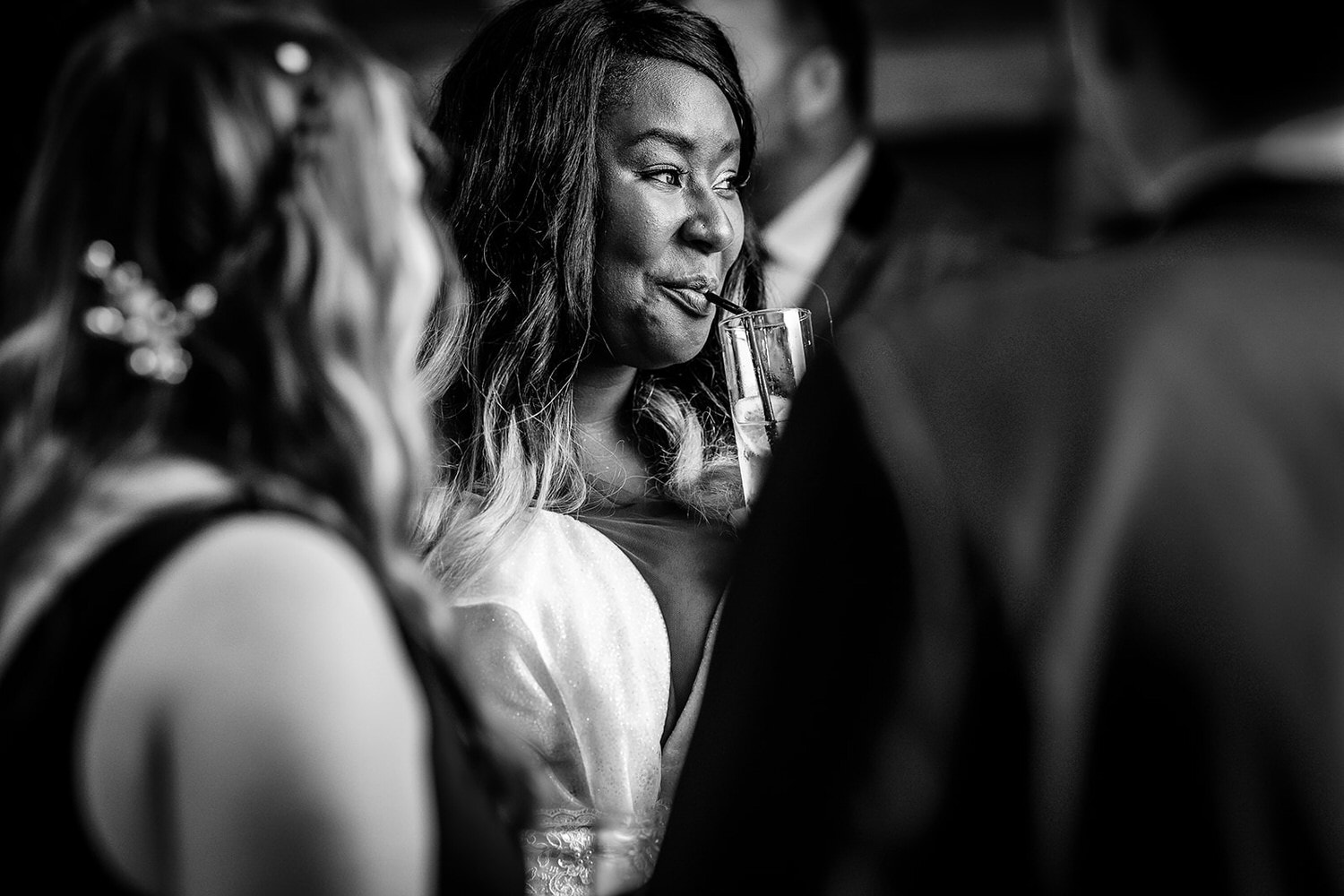 black and white photo of bride having a drink and chat High Billinghurst Farm