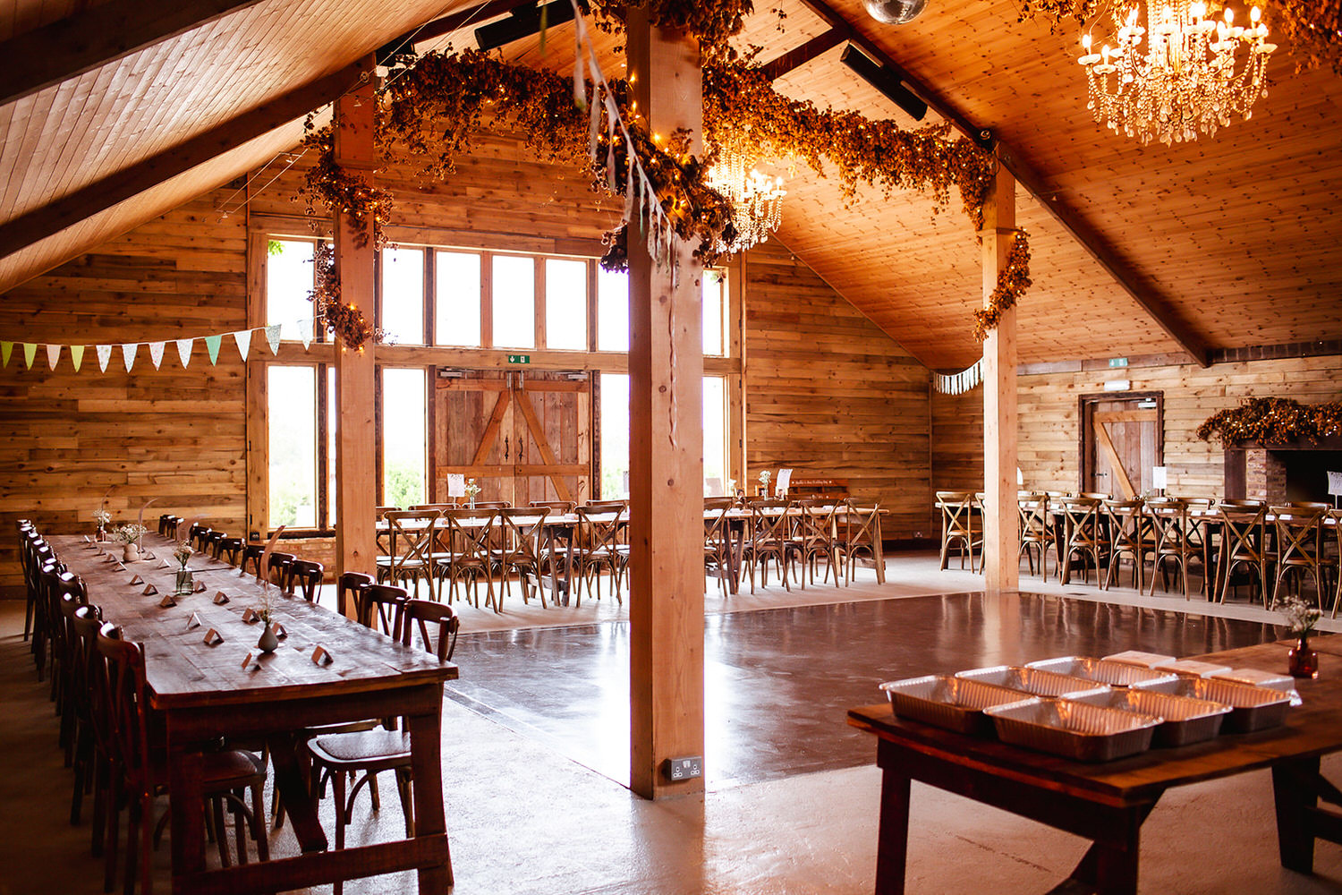 rustic reception room at High Billinghurst Farm, Surrey indoor and outdoor wedding venue