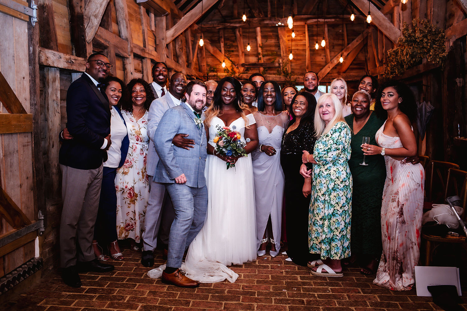 indoor wedding group photo at High Billinghurst Farm