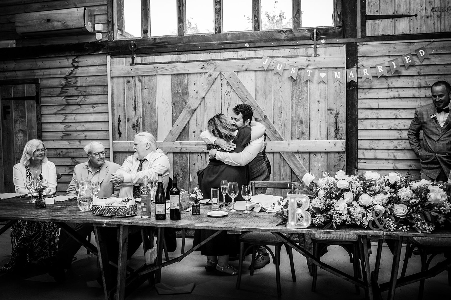 groom gives a cuddle to her mum during emotional speeches High Billinghurst Farm