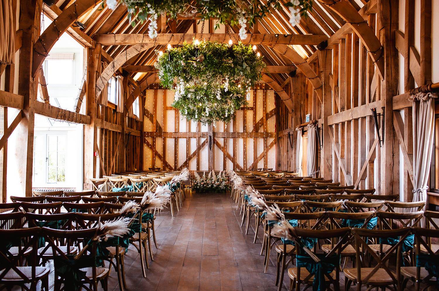 wedding ceremony deccorated with flowers at Gate Street rustic barn