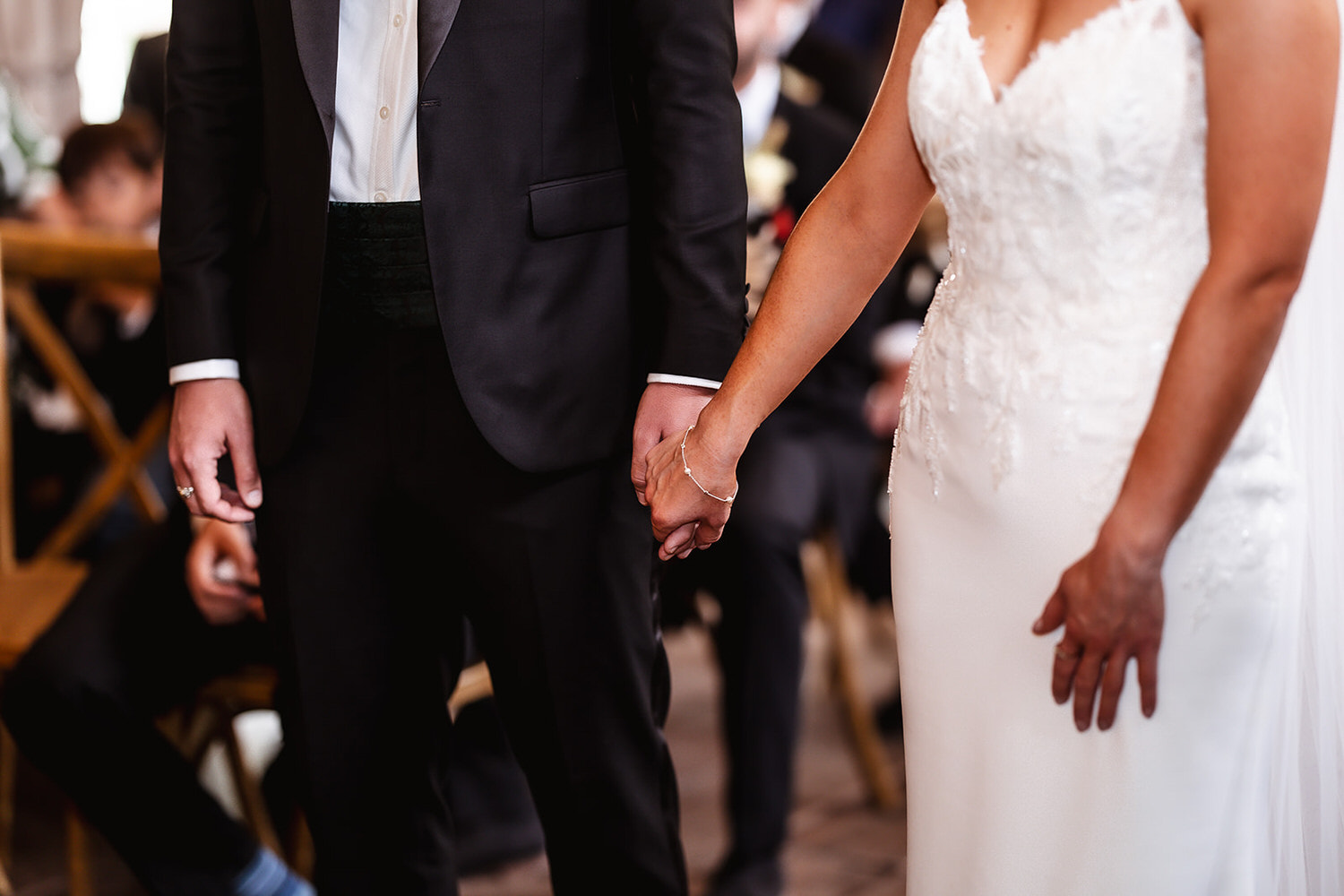 bride and groom holding their hands during the ceremony. Gate Street wedding photography