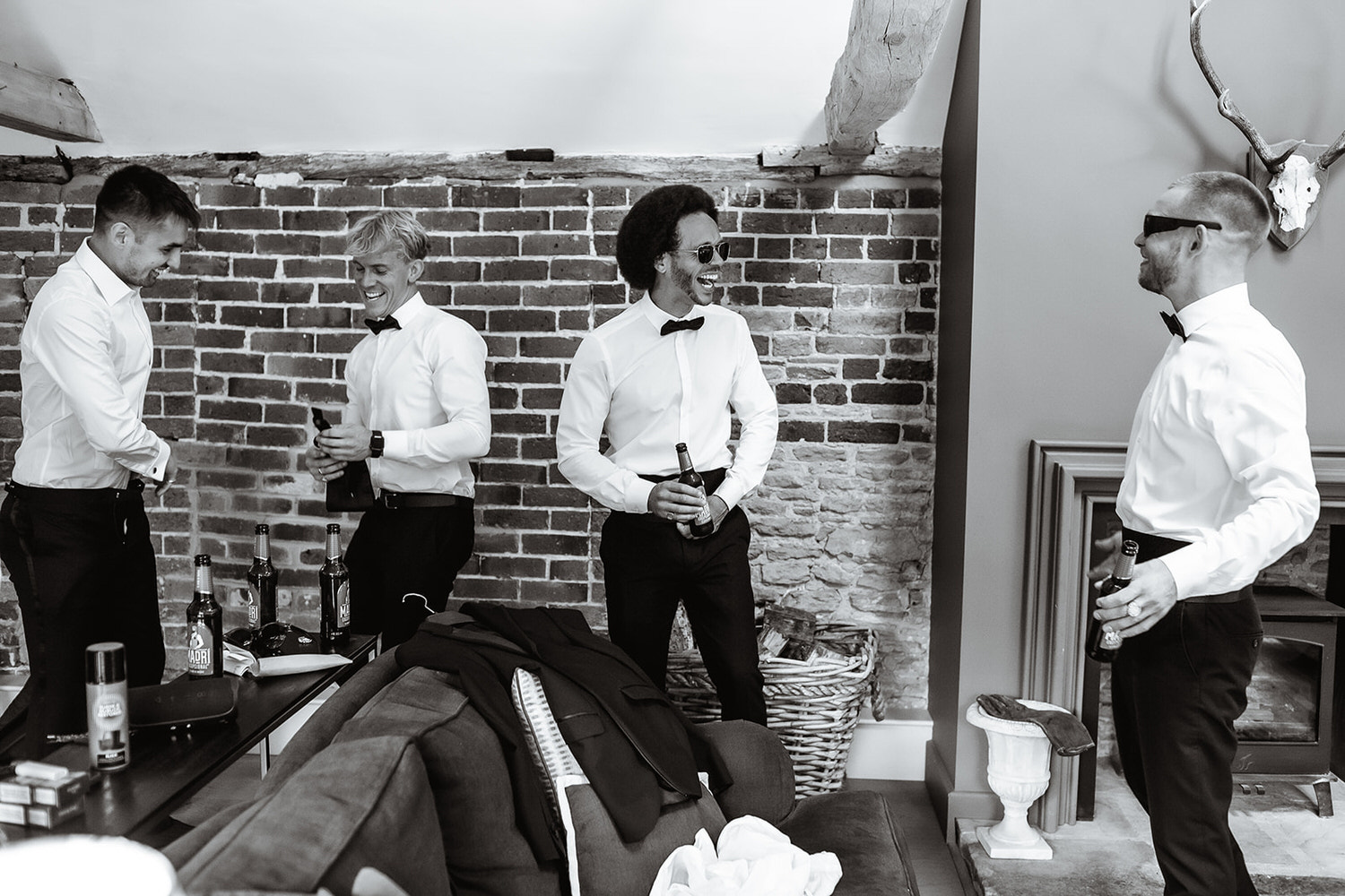 relaxed and fun photo of groom and groomsman getting ready at Gate Street in Surrey