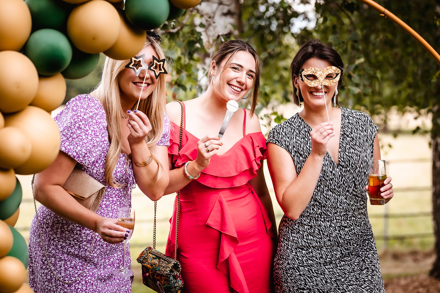 fun photo of wedding guests outside in the garden at Surrey wedding venue