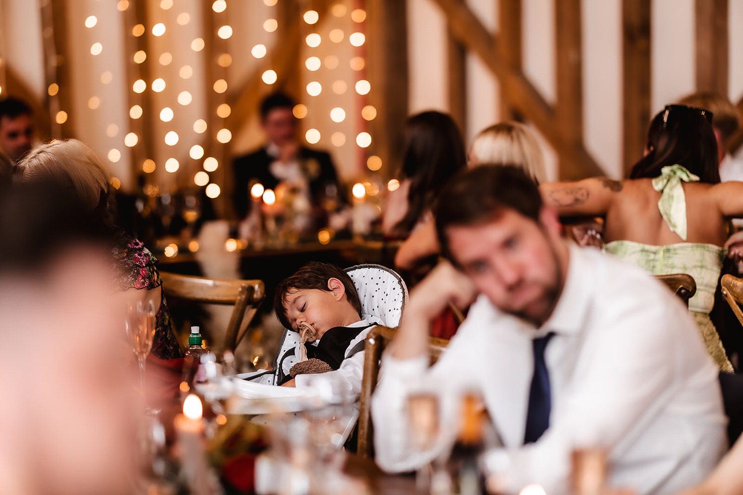 candid photo of sleeping child during the wedding speeches at Gate Street