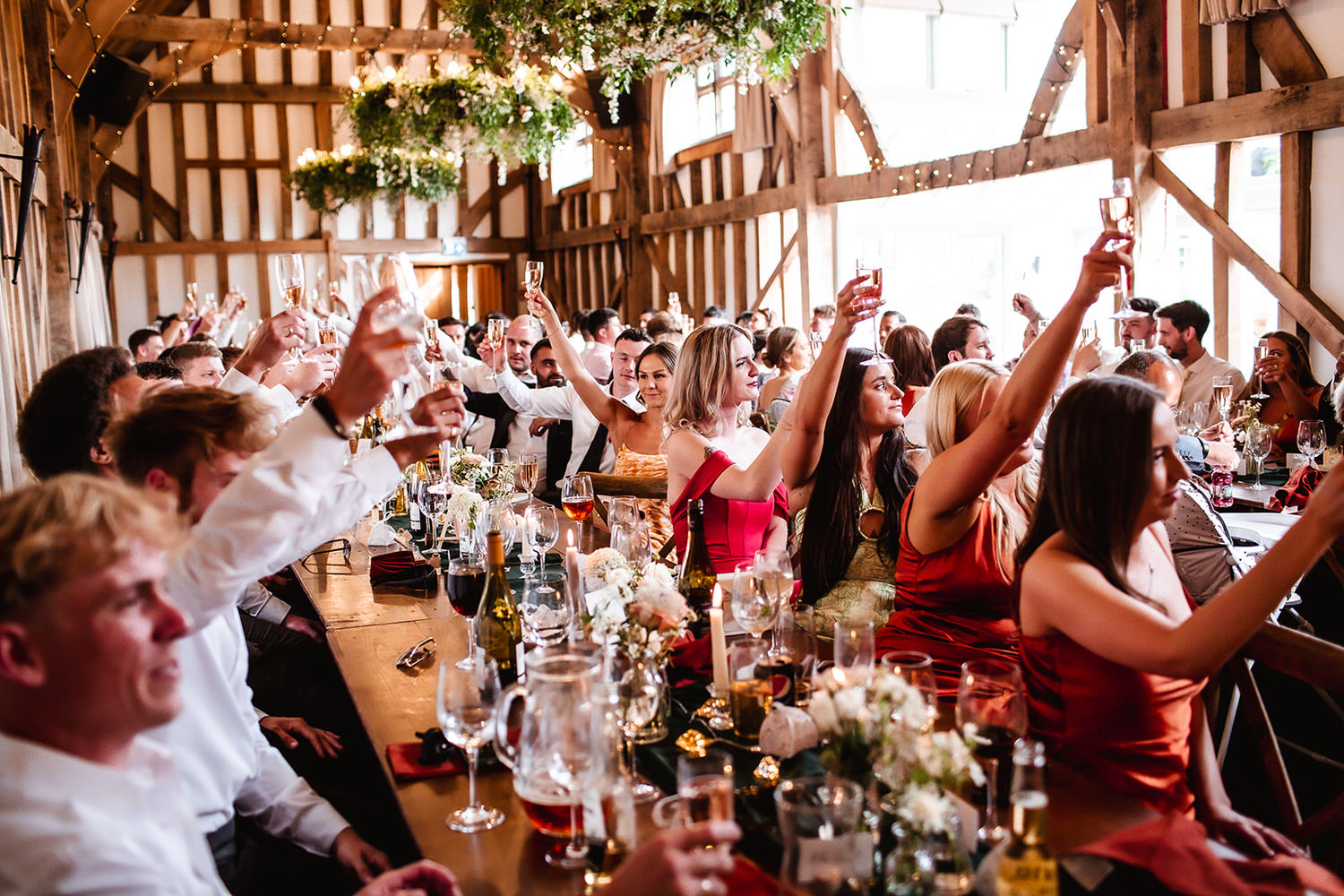 wedding guests holding their glasses during the speech at Gate Street