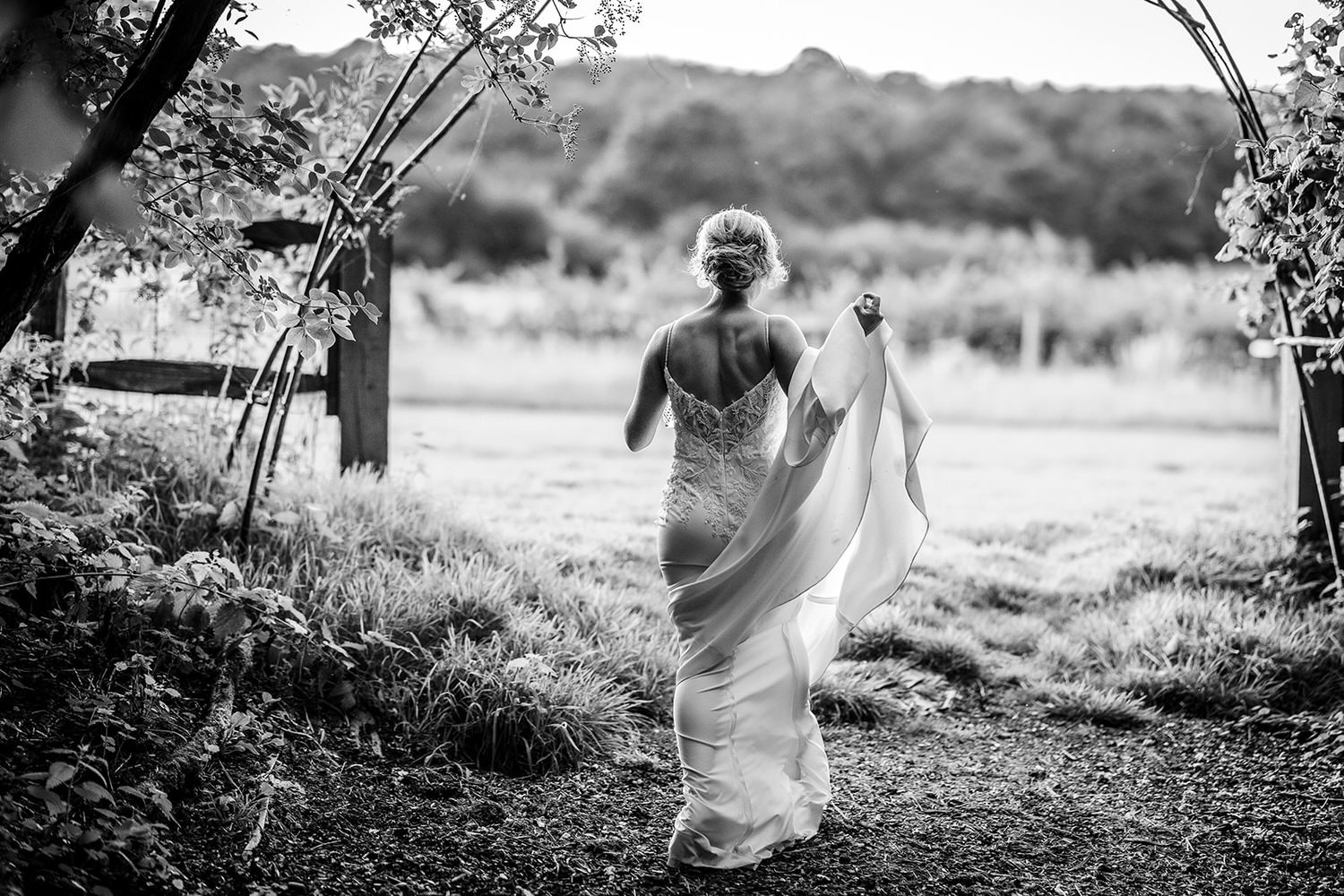 Candid photo of bride leaving a forest at Gate Street