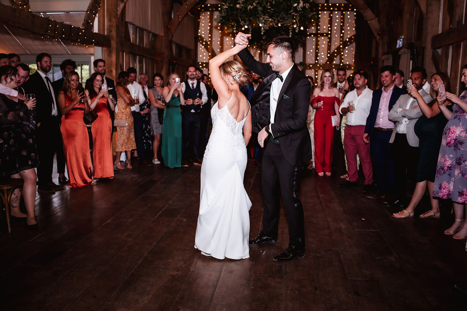 First dance photo at barn in Surrey wedding venue. Guildford wedding photographer