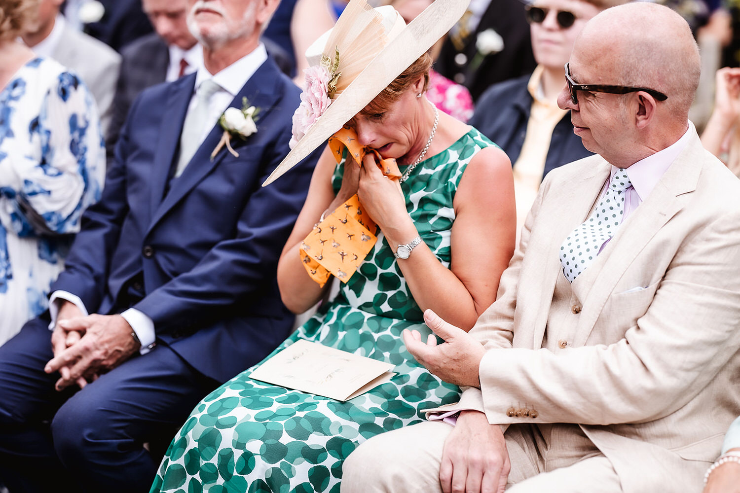 emotional photo of Bride's mum during the wedding ceremony at Winkworth Farm