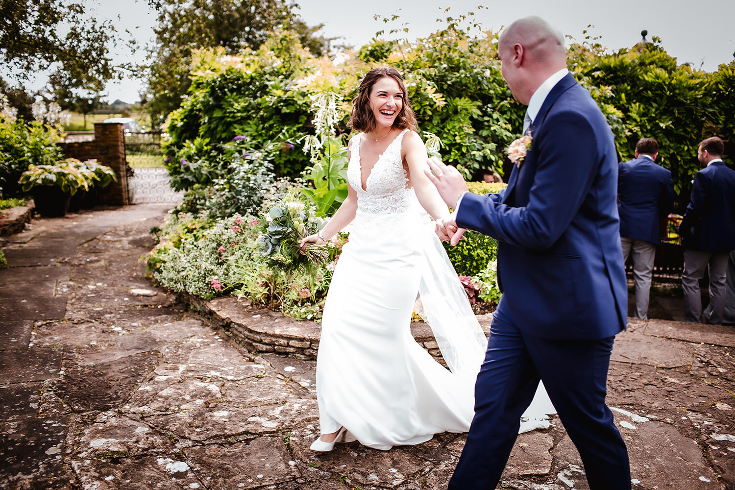 candid photo of married couple at Winkworth Farm. Malmesbury wedding photographer