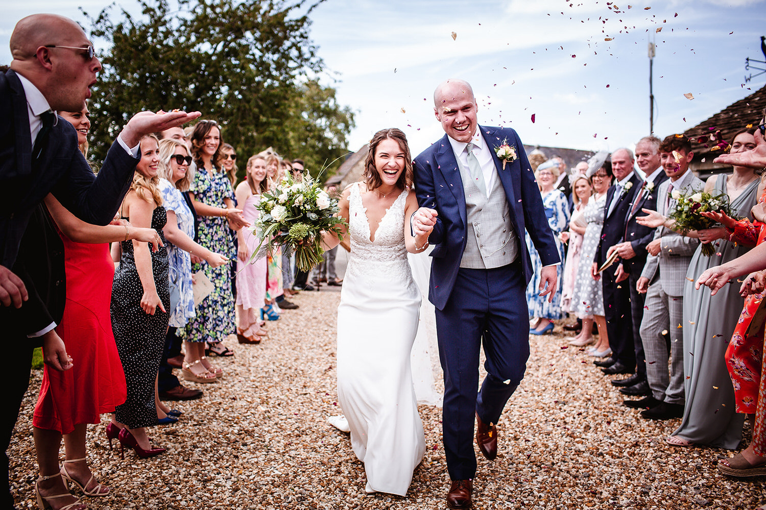 Confetti photo of bride and groom at Winkworth Farm wedding photographer