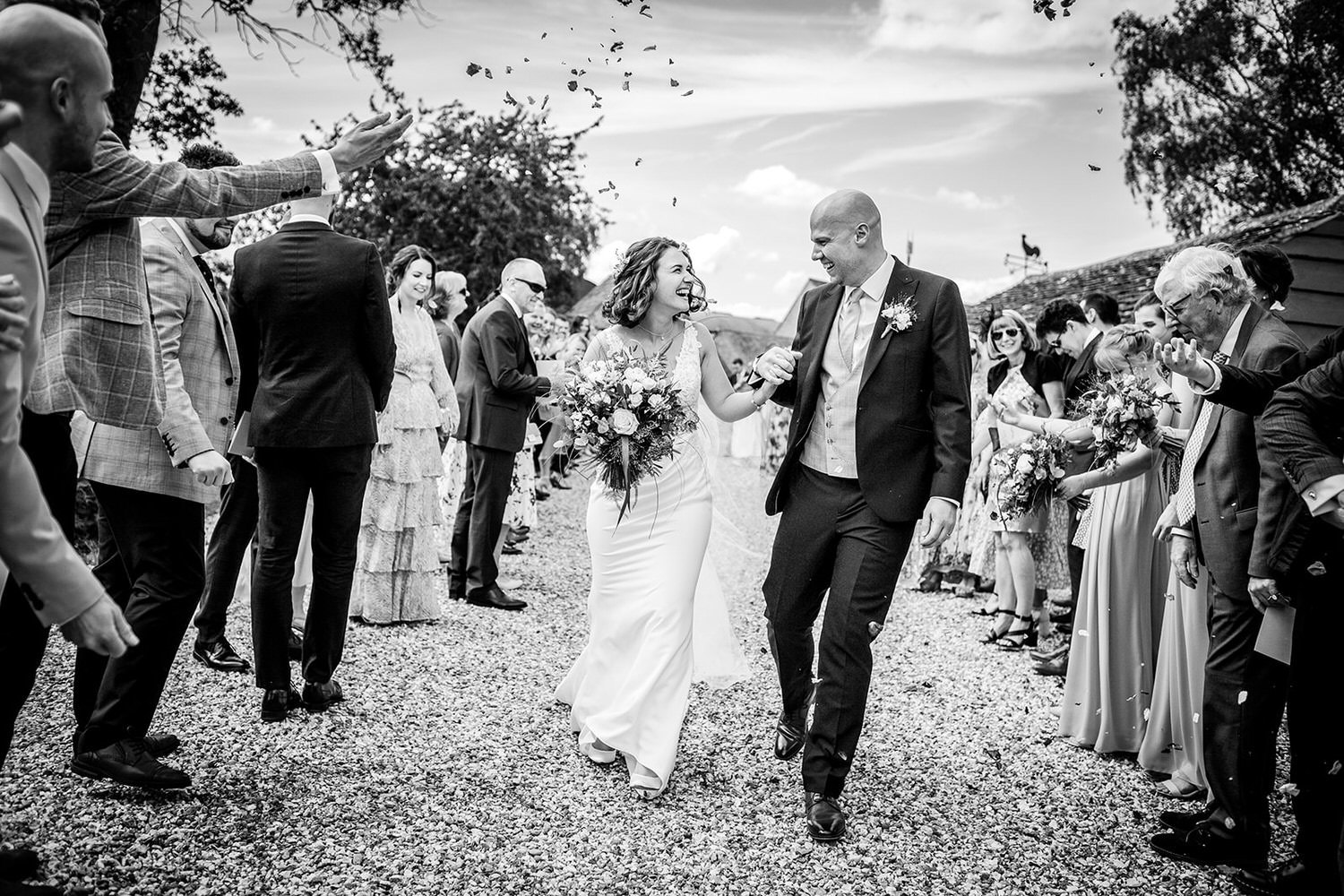 black and white photo of confetti shoot at Wilthire wedding venue