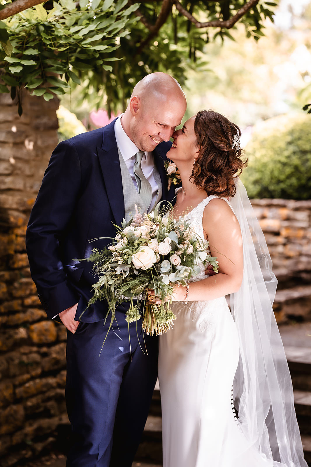 bride an groom candid photo at Winkworth Farm, outdoor wedding ceremony