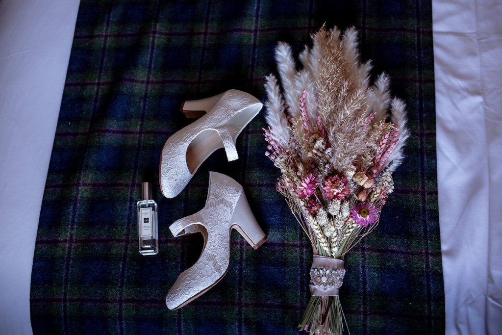 wedding shoes with dried wedding flowers