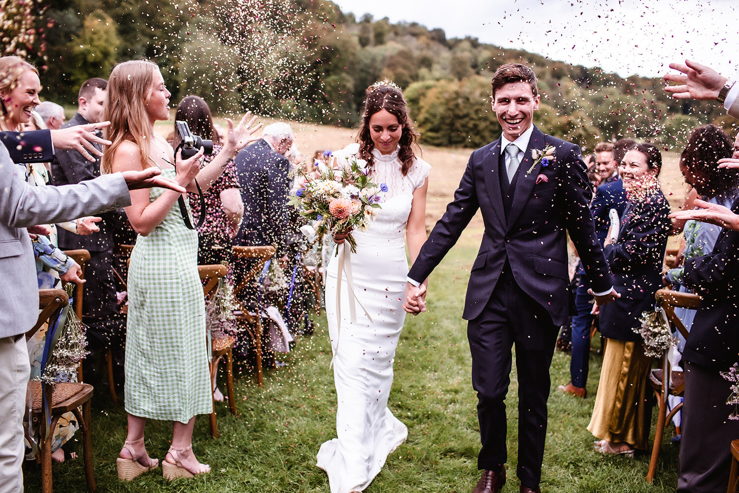 outdoor wedding confetti of bride and groom in Hamsphire