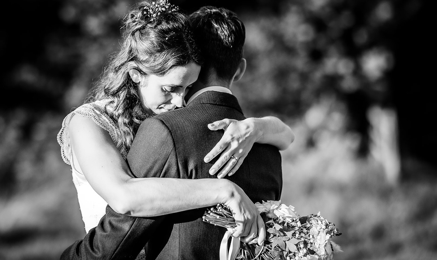 romantic black and white photo of bride and groom cuddling each other. Hampshire wedding photography