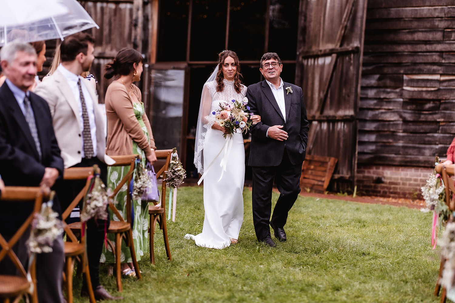 outdoor Hampshire wedding ceremony in the field. Barn at Gilbert White's