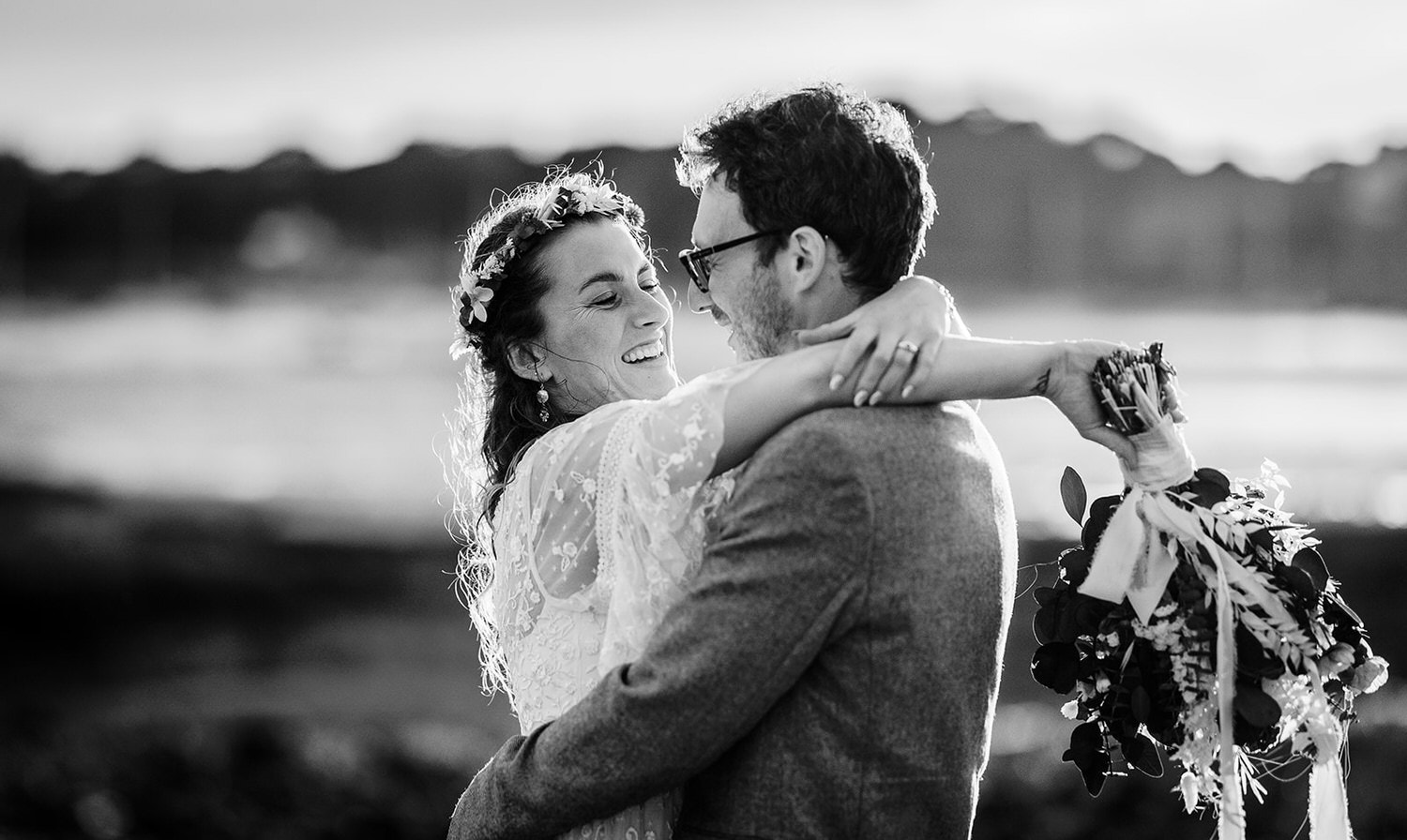 sunset photo of bride and groom cuddling each other at Warsash Harbour