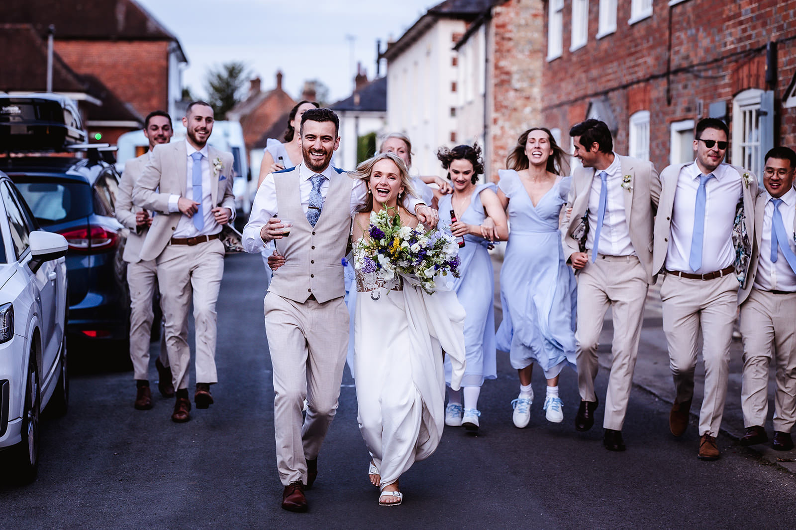 fun photo of bride, groom, bridesmaids and groomsman