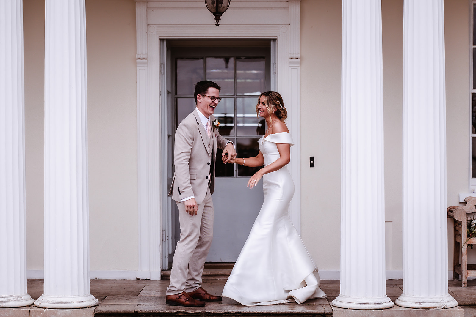 bride and groom dancing outside of their wedding venue in Devon