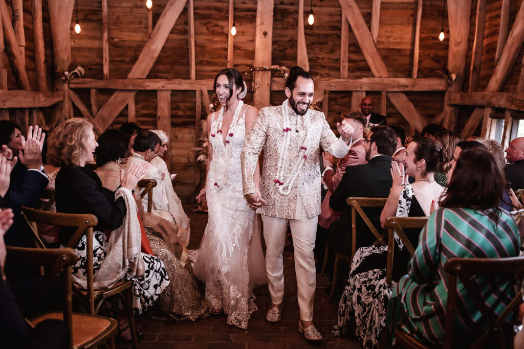 bride and groom just leaving a wedding ceremony after saying I do. just married couple