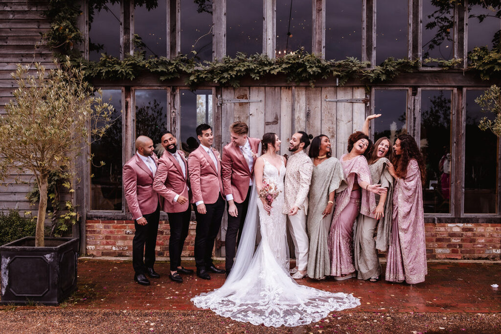 funny photo of bride and groom with their wedding party.