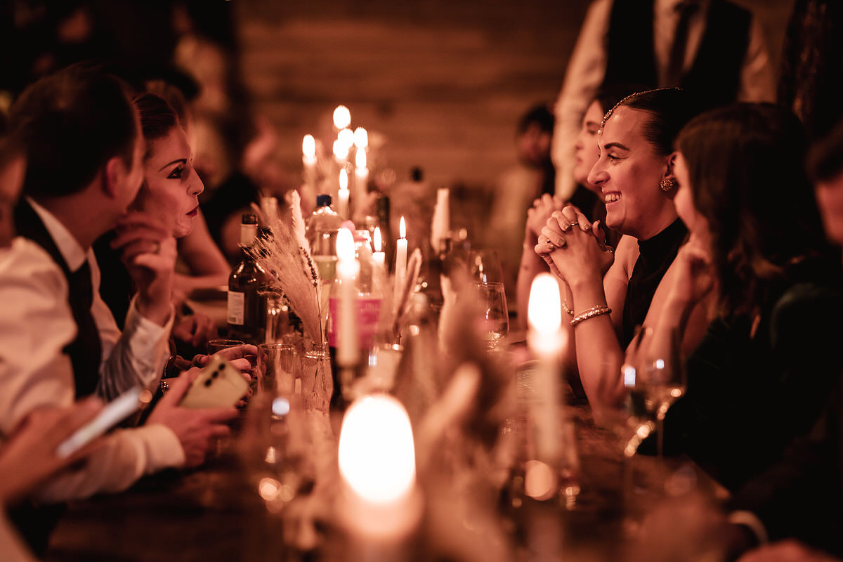 candid photos of guests having a chat during the wedding reception