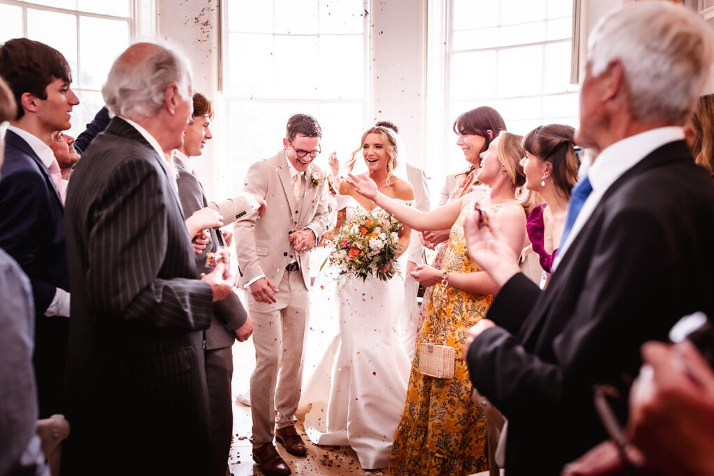 bride and groom leaving the ceremony room