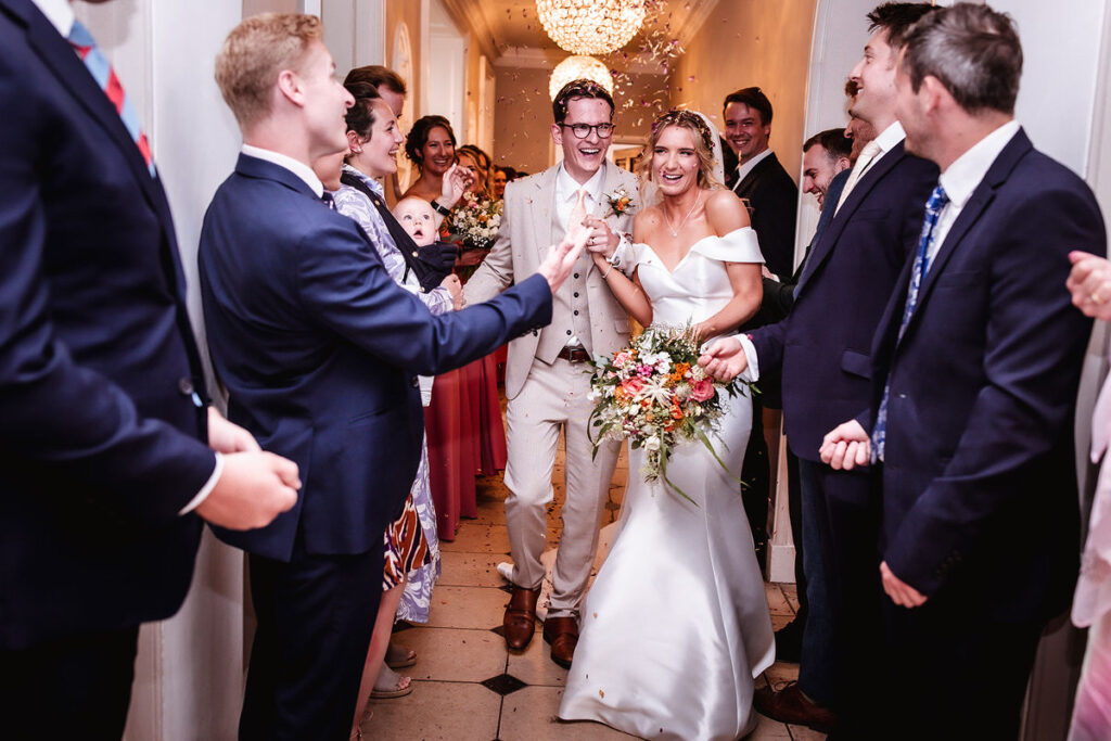 indoor confetti photo of wedding couple