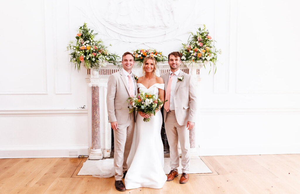 formal group photo of bride and her brothers/siblings