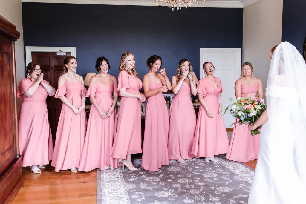 emotional photo of first look of bride with her bridesmaid