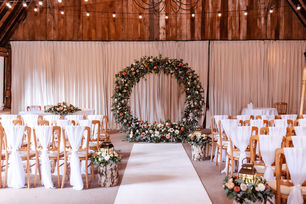 wedding flower arch at rustic Hampshire wedding venue