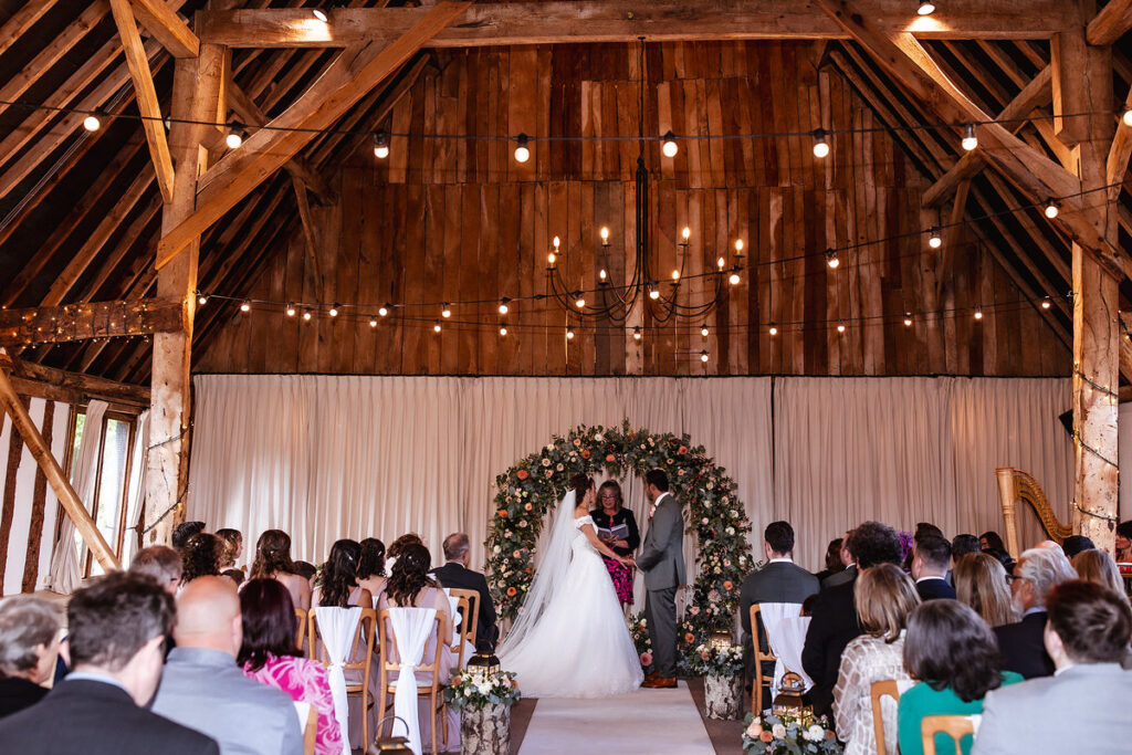 bride and groom getting married at rustic barn in Hampshire